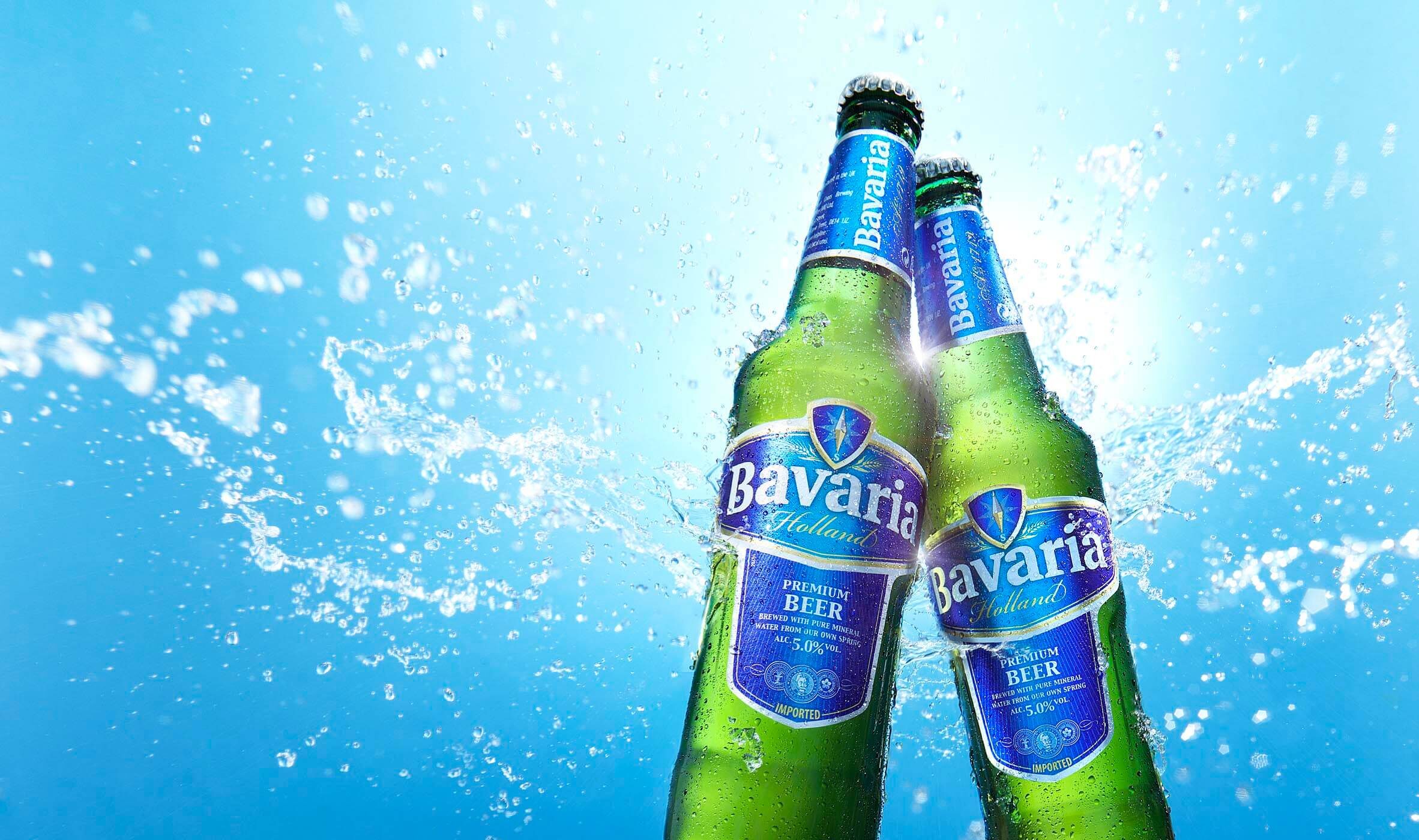 Two bottles of Bavaria beer splashed with water photographed by London drinks photographer Warren Ryley