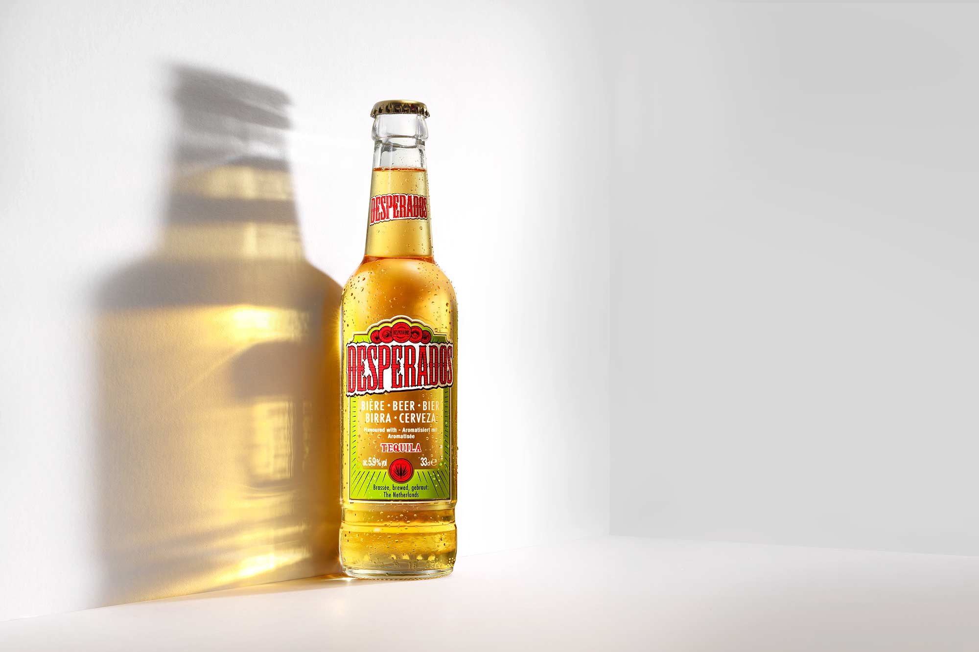 Desperados beer bottles in sunlight by London based drinks photographer Warren Ryley