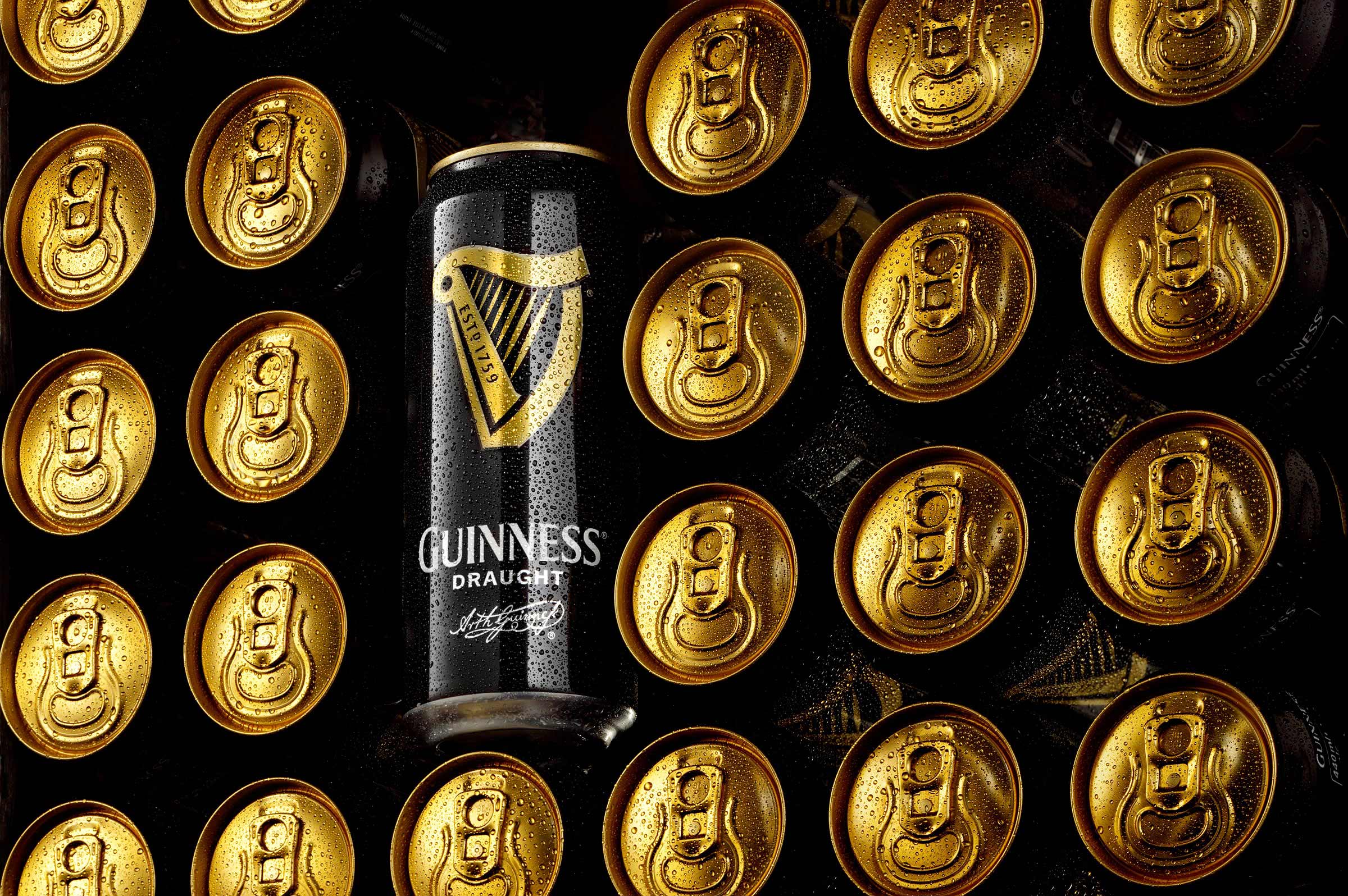Stack of cold Guinness cans photographed by drinks photographer Warren Ryley in his London studio